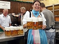 lady holding beer jugs